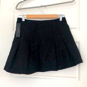 Black patterned mini skirt